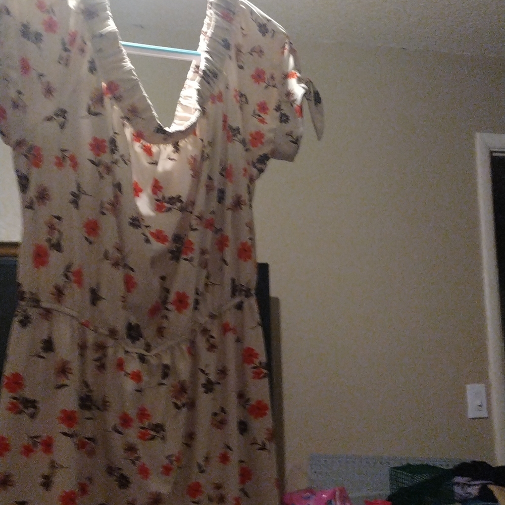 Cram colored with flowers on it dress short ,falls onto your shoulders,